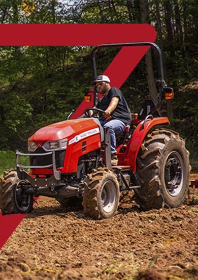 Close-up mobile view of a Massey Ferguson compact utility tractor tilling a field with a red graphic overlay
